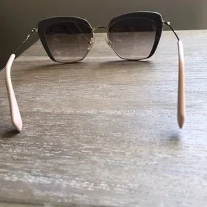 Miu Miu sunglasses. Grey Gold light peach on ear piece Miu Miu | Accessories | Miu Miu Sunglasses Grey Gold Light  main image 3